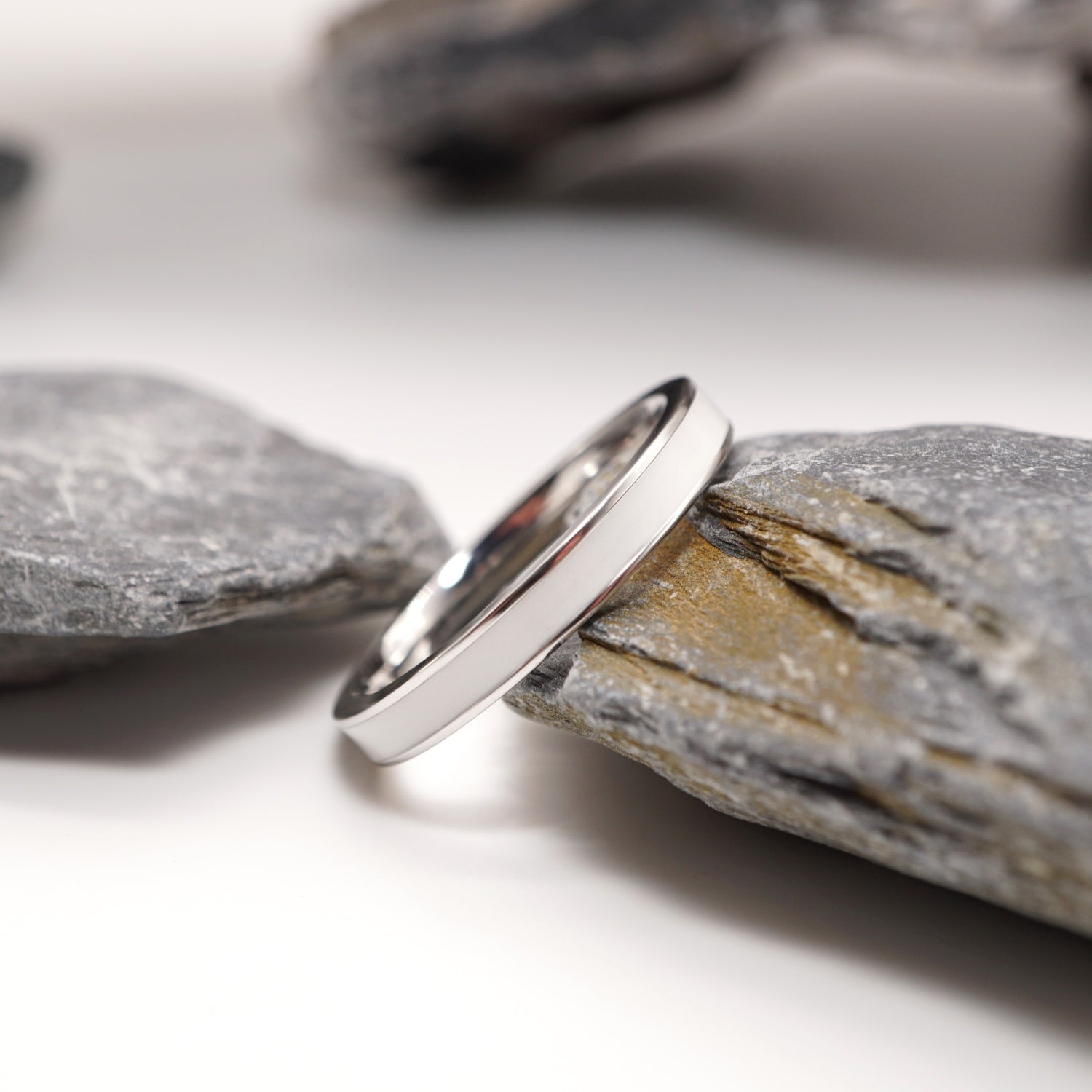 Close-up of sterling silver semen keepsake ring with a reflective polished surface, highlighting its modern and unique craftsmanship