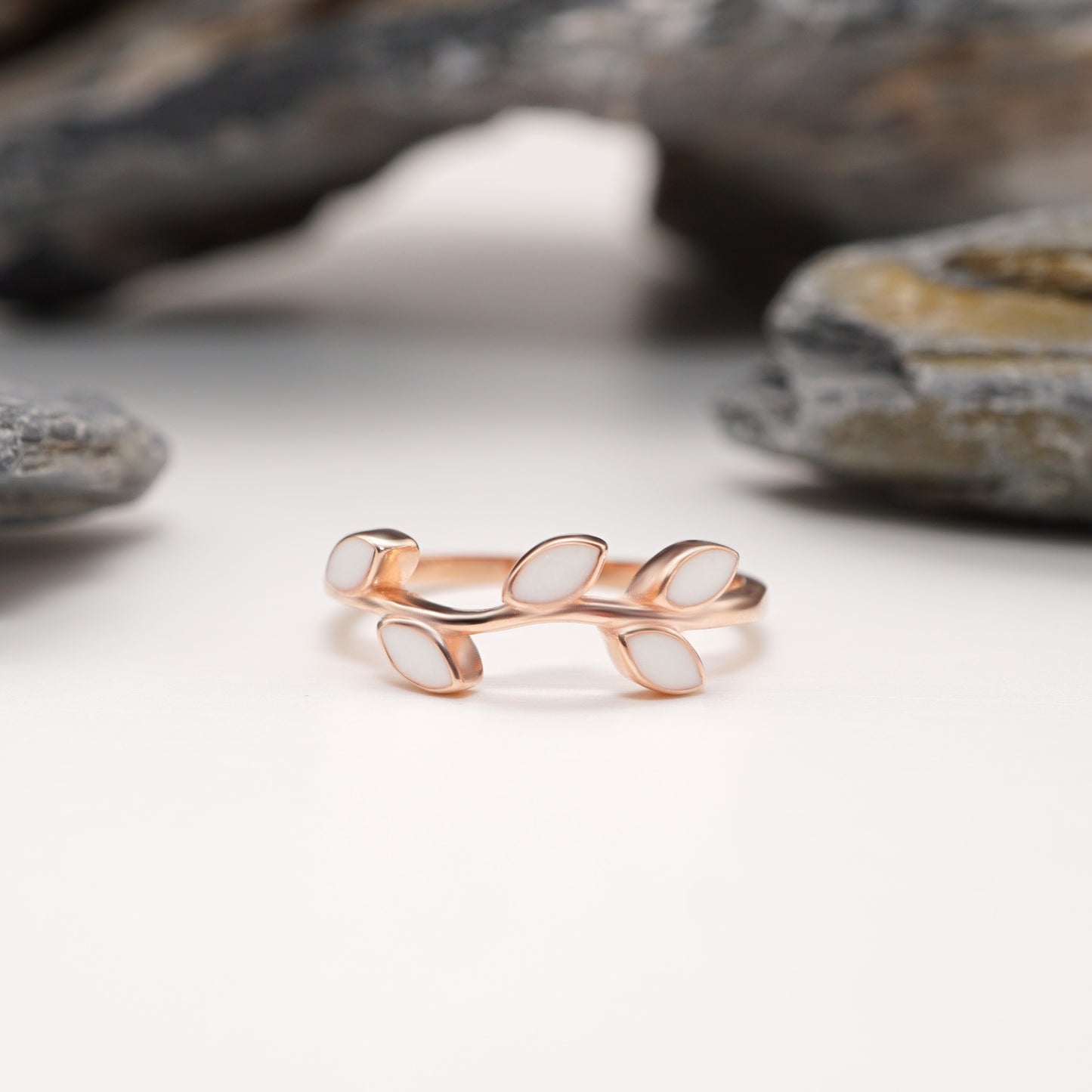 Close-up of Leaf Keepsake Ring in rose gold, showcasing its organic branch design and bold, leaf-shaped semen inlays.