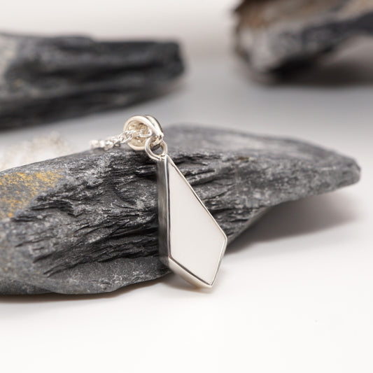 Sterling silver diamond-shaped pendant with custom semen inlay, bold intimate jewellery for modern design lovers.