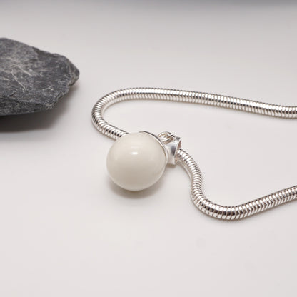 Orb Keepsake Pendant featuring a 13mm resin sphere infused with semen, finished with a polished sterling silver cap