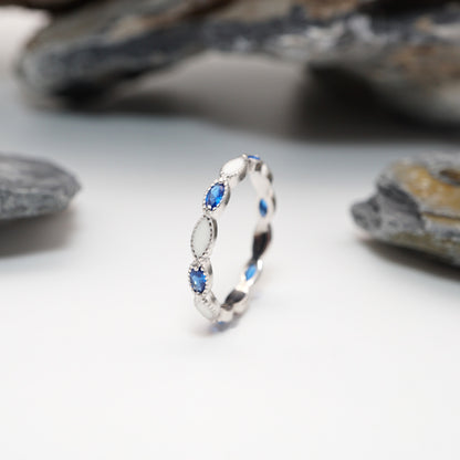 Eternity Keepsake Ring in sterling silver with marquise-shaped custom semen inlays and alternating blue CZ stones, featuring milgrain detailing.