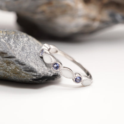 Close-up of Luxe Keepsake Half Band in sterling silver, showcasing its marquise-shaped semen inlays, light blue CZ stones, and intricate milgrain accents.