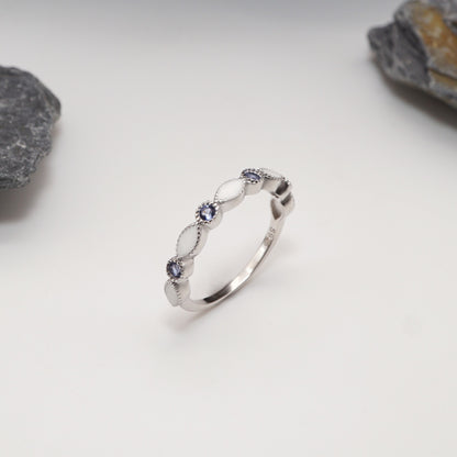 Luxe Keepsake Half Band in sterling silver with alternating custom semen inlays and CZ stones in light blue, featuring milgrain detailing.