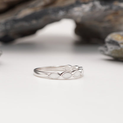 Side view of Silhouette Keepsake Ring in polished sterling silver, highlighting its minimalist band and unique custom inlays.