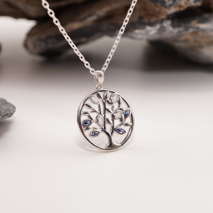 Sterling silver Tree of Life pendant with semen inlays and customisable CZ stones in blue and white, bold intimate jewellery.