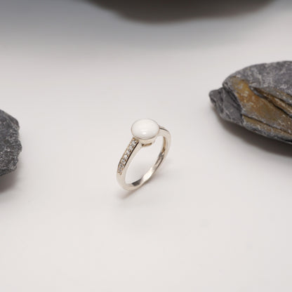 Sterling silver Crown Keepsake Ring with bold round semen inlay and pavé-studded band, perfect for daring intimate jewellery.