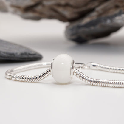 A sensual and bold Keepsake Bead crafted with semen-infused resin and premium metal finishes.